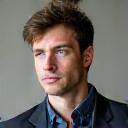 Professional headshot of Ben Carter, looking thoughtful and determined.